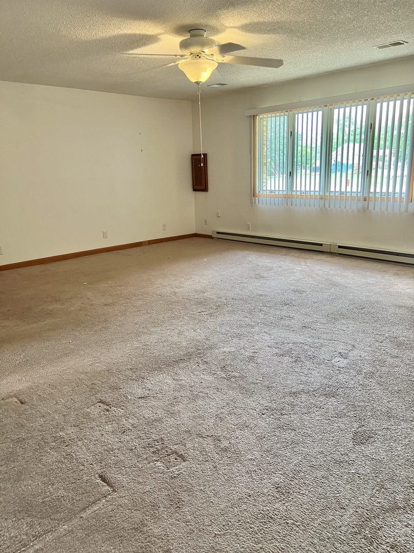 532 West Street, Unit 1 Lockport, IL 60441 - Photo 7 of 16 a view of an empty room with a window