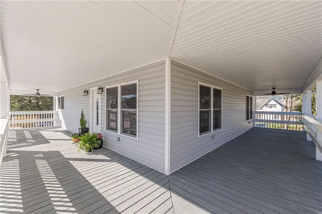 a kitchen with a sink window and cabinets
