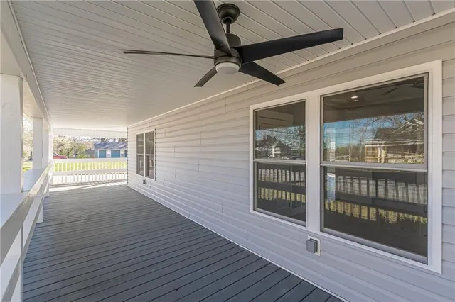 a kitchen with stainless steel appliances granite countertop a sink and a stove