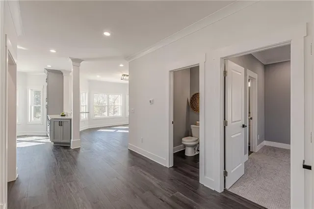 a bathroom with a toilet a sink and mirror