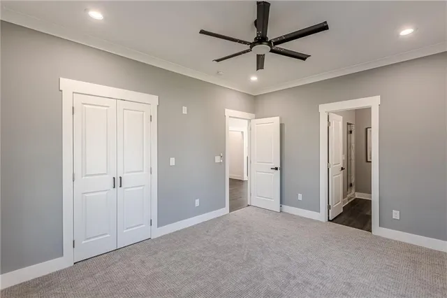 a view of a livingroom with a ceiling fan and window