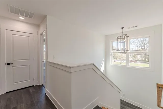 a kitchen with a refrigerator and a sink