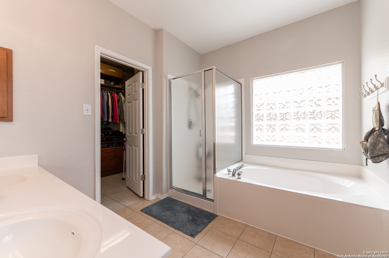 2604 Patron Village Schertz, TX 78108 - Photo 27 of 52 a bathroom with a bathtub and a shower