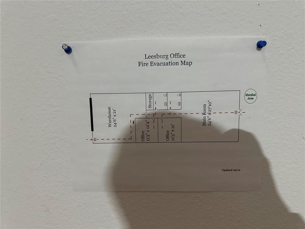 2848 West Main Street Leesburg, FL 34748 - Photo 11 of 13 a view of a utility room with racks on the wall