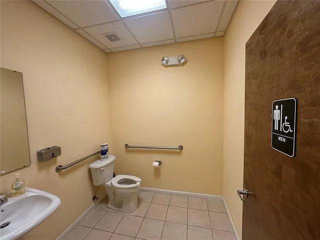 a bathroom with a toilet and a sink