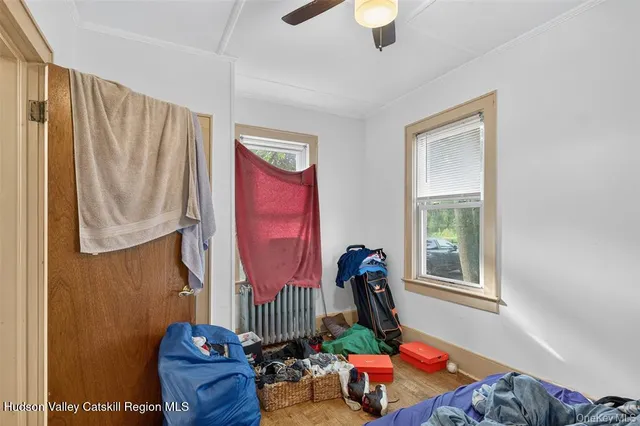 a bathroom with a toilet and a shower curtain