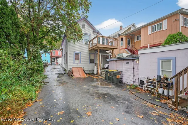 a view of a backyard with sitting area