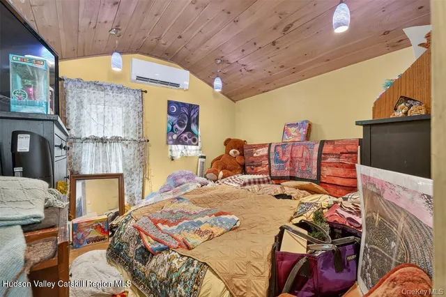 a view of a kitchen with fridge and rack