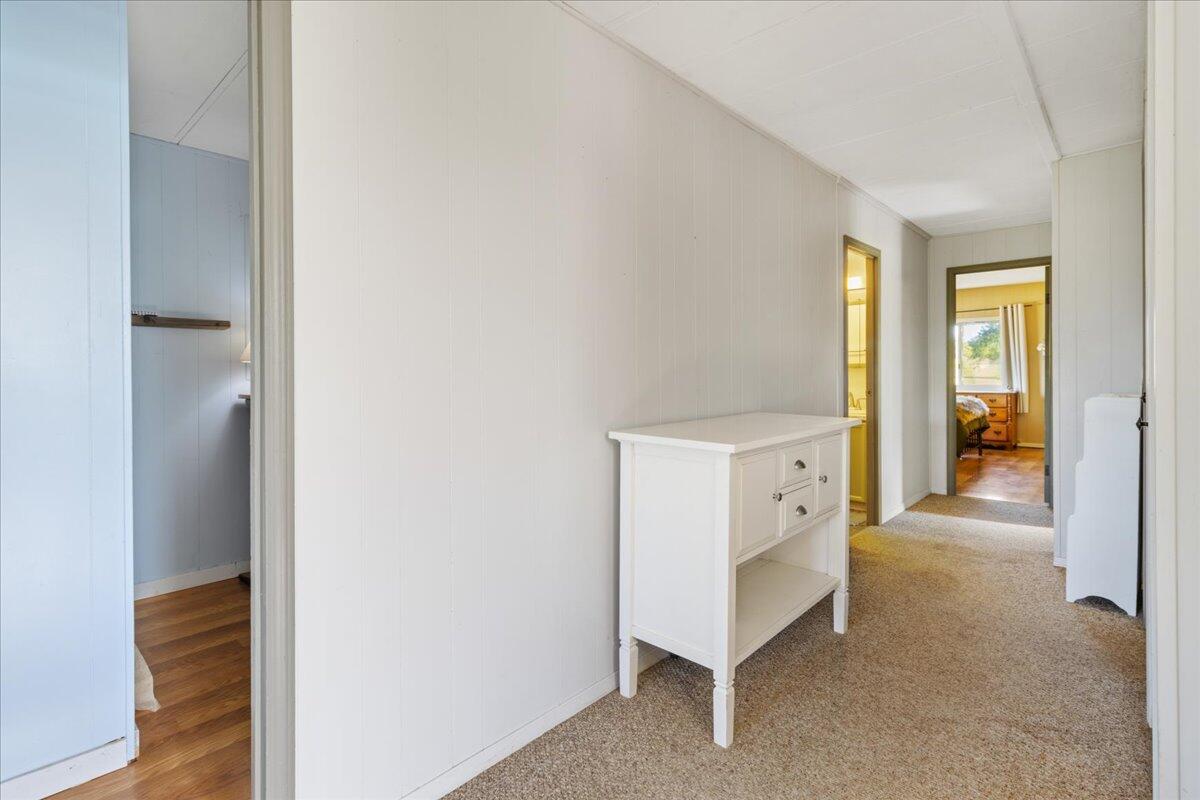 16455 Ridge Road Red Bluff, CA 96080 - Photo 11 of 56 a view of a hallway with bathroom and wooden floor