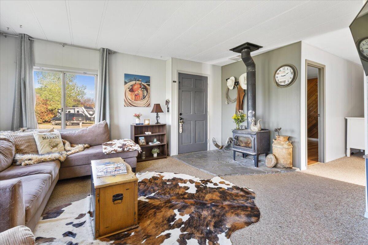 16455 Ridge Road Red Bluff, CA 96080 - Photo 4 of 56 a living room with furniture and a clock