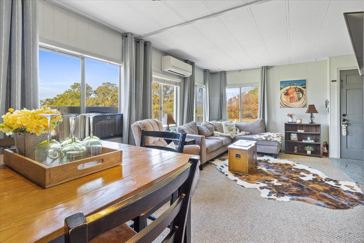 16455 Ridge Road Red Bluff, CA 96080 - Photo 5 of 56 a living room with fireplace furniture and a large window