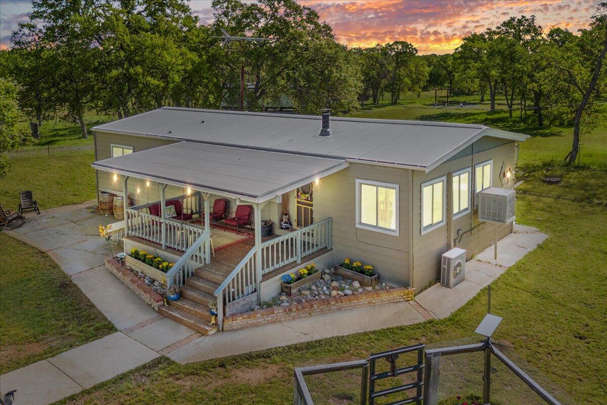 16455 Ridge Road Red Bluff, CA 96080 - Photo 54 of 56 a roof deck with table and chairs under an umbrella