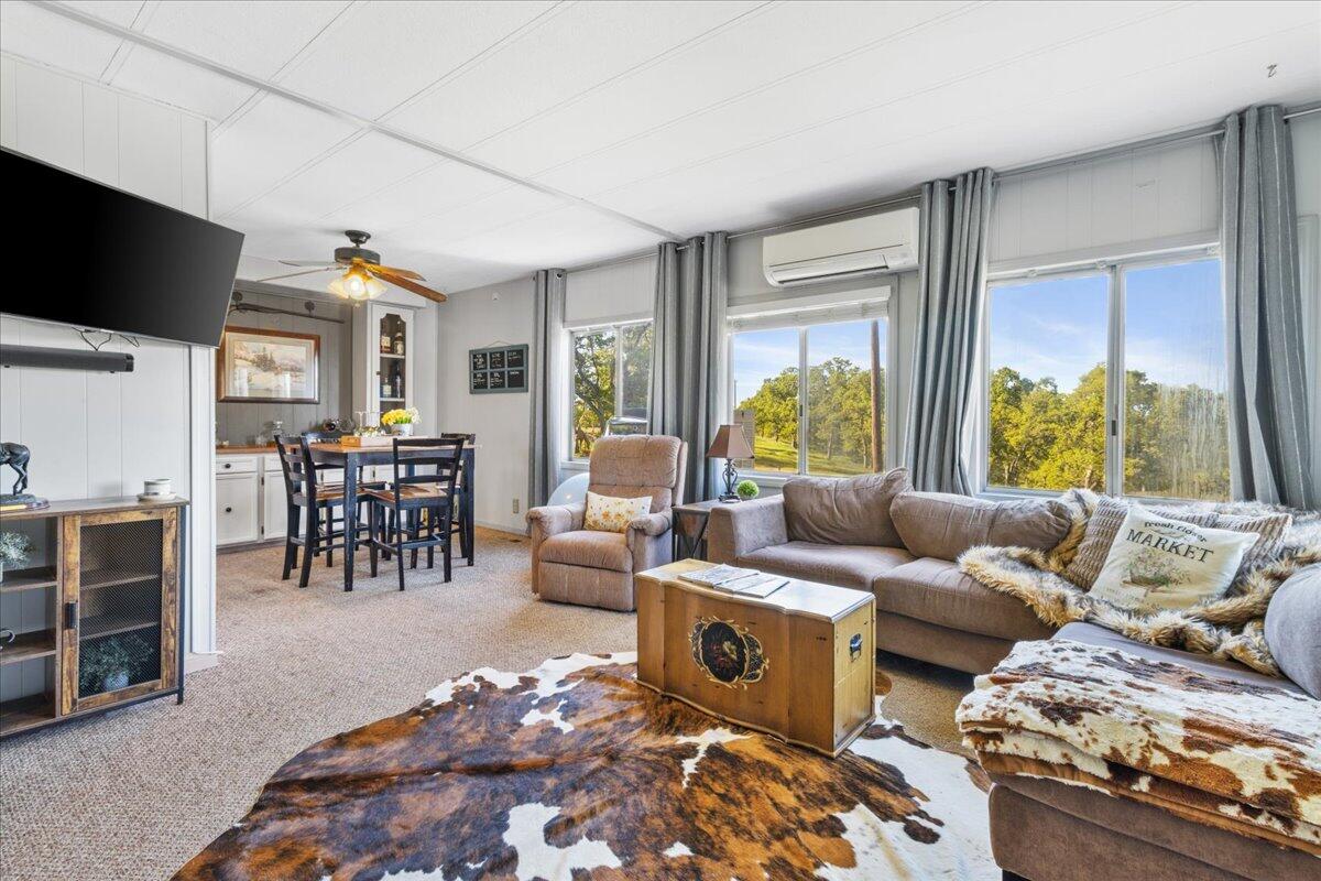 16455 Ridge Road Red Bluff, CA 96080 - Photo 7 of 56 a living room with furniture and a flat screen tv