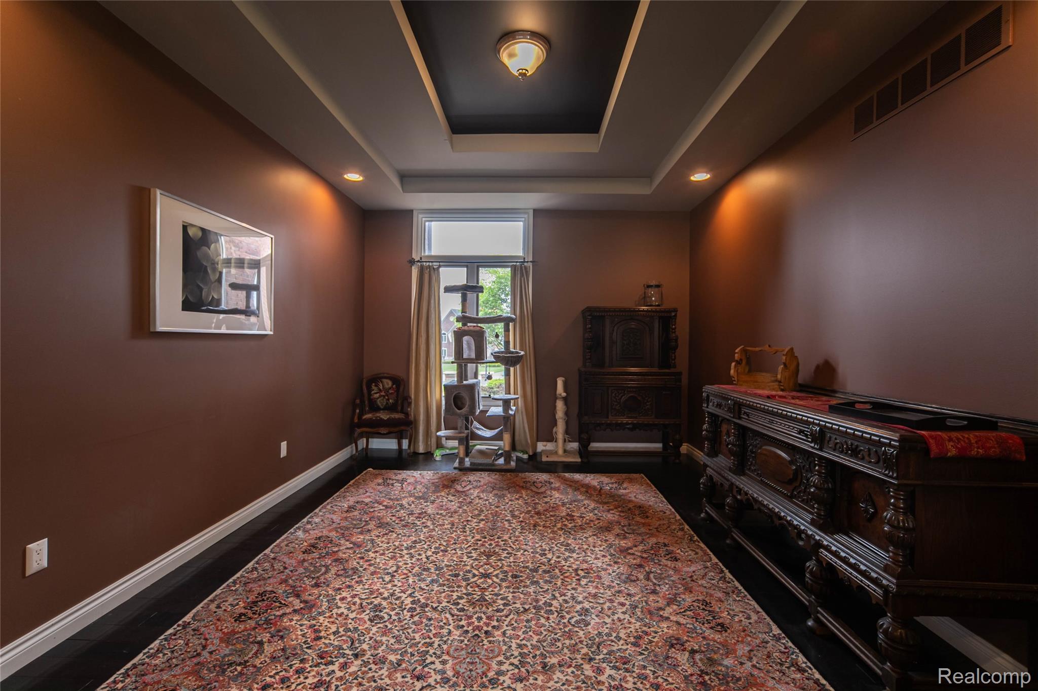 67102 Rachael Lane Washington, MI 48095 - Photo 17 of 37 Sitting room with recessed lighting, a tray ceiling, and dark wood-style flooring