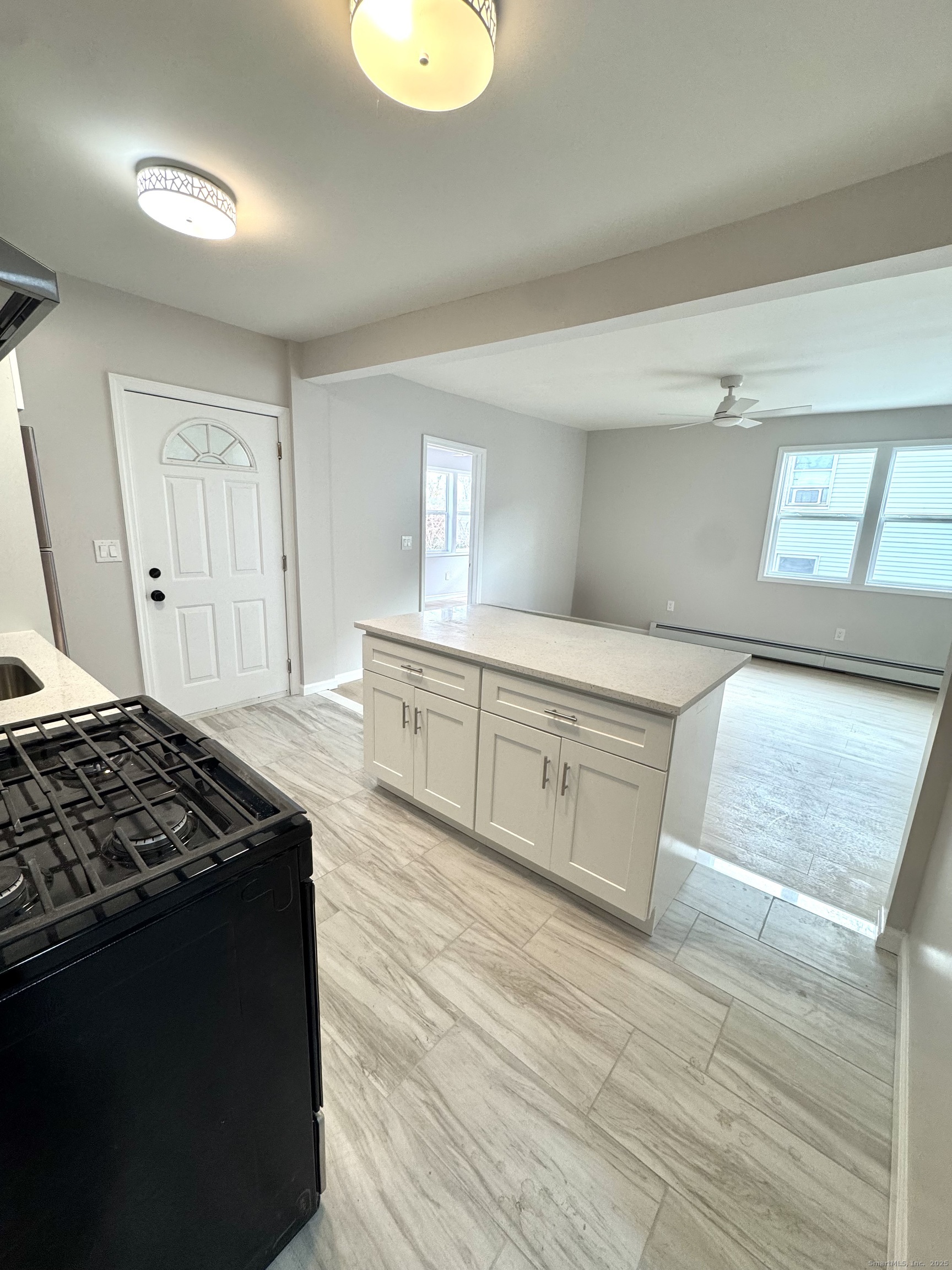 a kitchen with stainless steel appliances granite countertop a stove and a sink