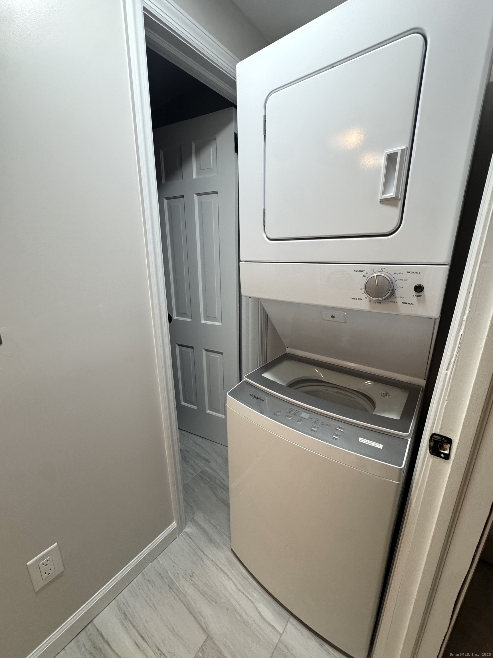 24 Woodbury Avenue, Unit 1A Norwalk, CT 06850 - Photo 6 of 7 a utility room with wooden floor washer and dryer