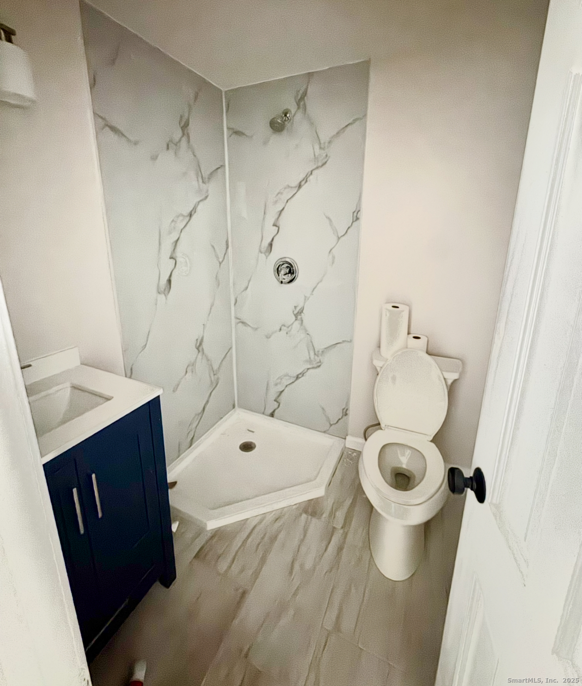 24 Woodbury Avenue, Unit 1A Norwalk, CT 06850 - Photo 7 of 7 a bathroom with a sink toilet and shower