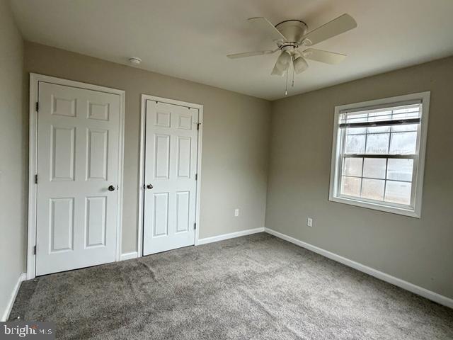 2120 Ruxton Drive Salisbury, MD 21801 - Photo 13 of 18 an empty room with a ceiling fan and a window