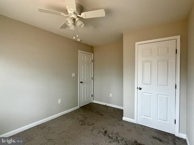 2120 Ruxton Drive Salisbury, MD 21801 - Photo 15 of 18 an empty room with a ceiling fan and carpet