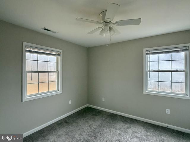 2120 Ruxton Drive Salisbury, MD 21801 - Photo 16 of 18 an empty room with windows and fan