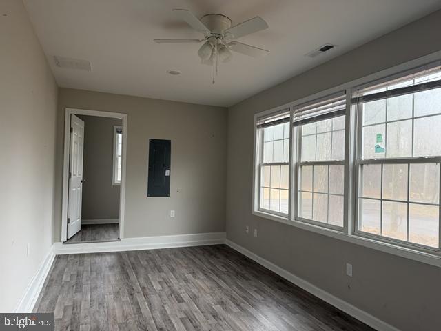 2120 Ruxton Drive Salisbury, MD 21801 - Photo 5 of 18 wooden floor in an empty room with a window