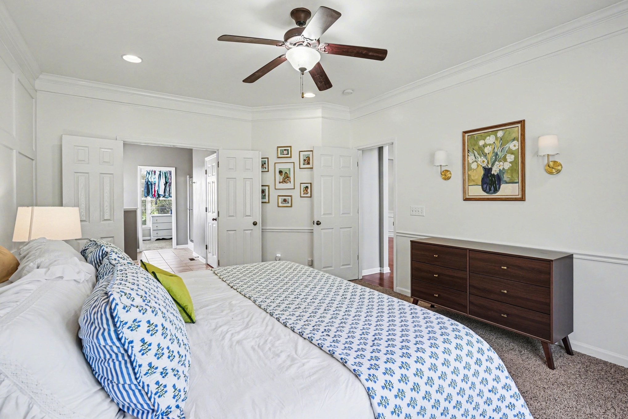 344 Landings Way Mount Juliet, TN 37122 - Photo 16 of 26 a bedroom with a bed and a chandelier