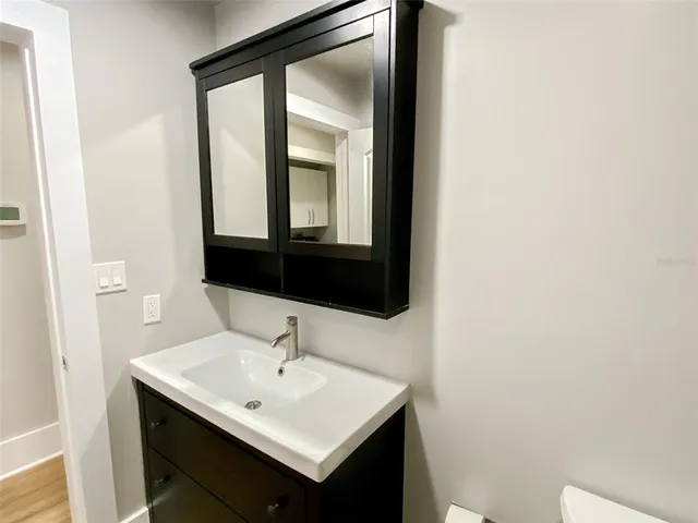 a bathroom with a sink and a mirror