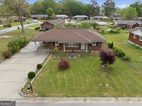a aerial view of a house with swimming pool