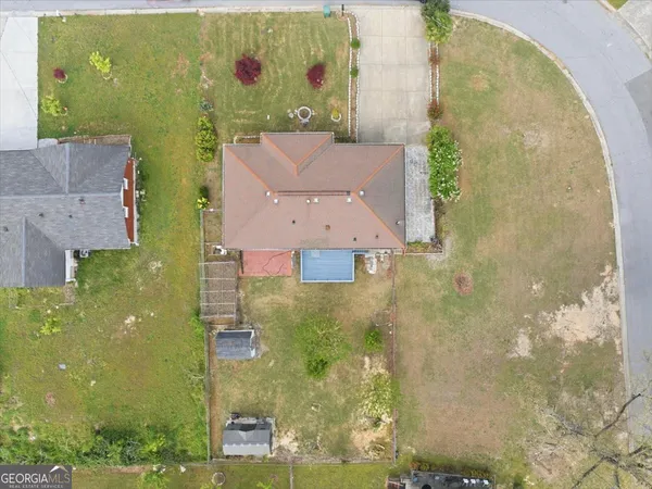 an aerial view of residential houses with outdoor space