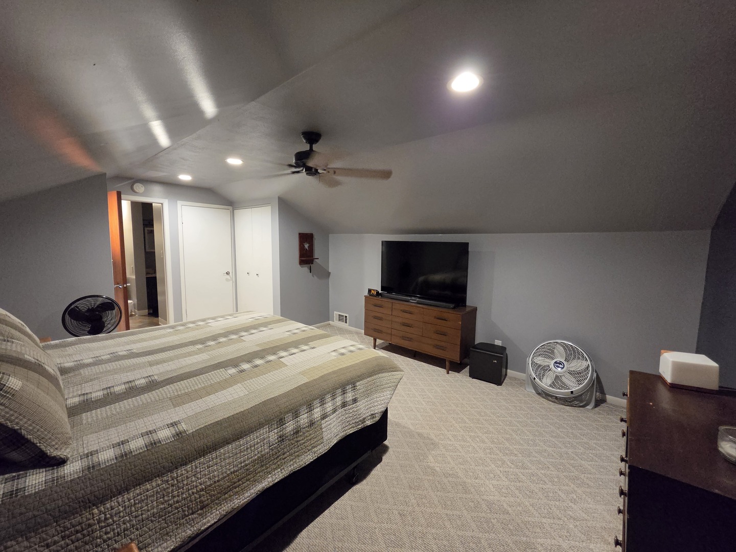 1000 West McKinley Road Ottawa, IL 61350 - Photo 12 of 19 a spacious bedroom with a bed and a flat screen tv
