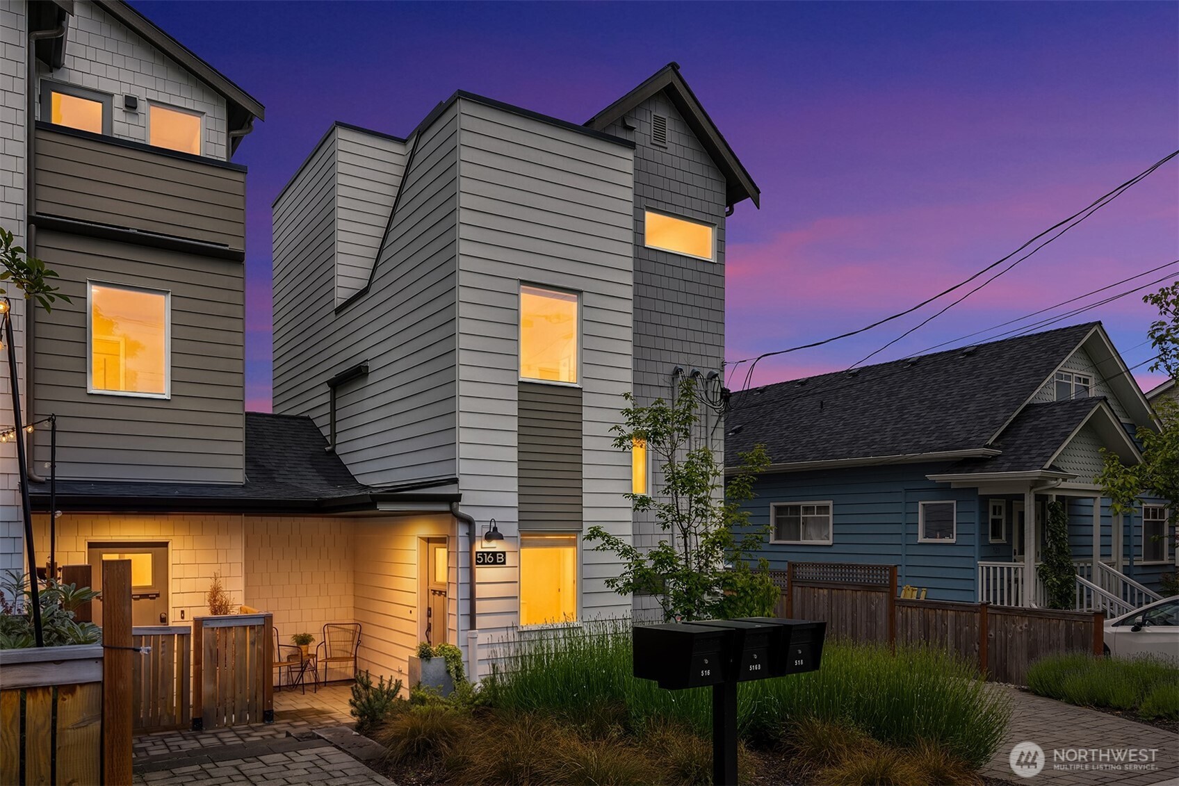 516 North 61st Street, Unit B Seattle, WA 98103 - Photo 2 of 17 a front view of a house with a yard