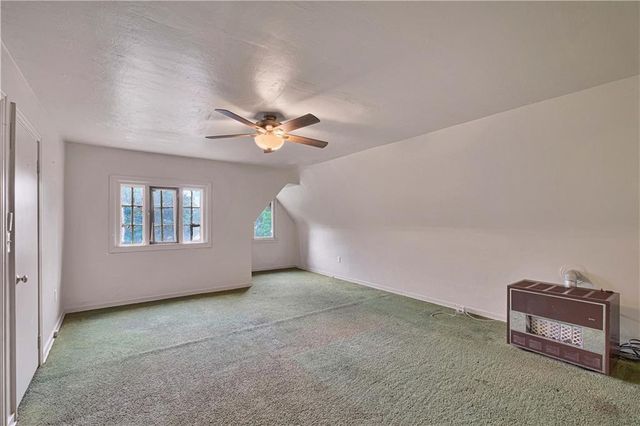 a view of an empty room with windows