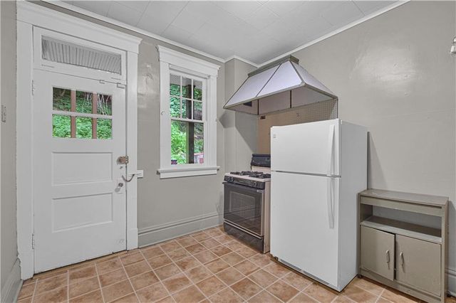 a utility room with cabinets dryer and washer
