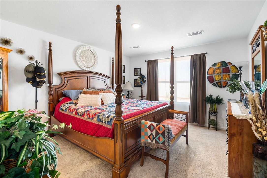 3623 East Andrea Drive Kingman, AZ 86409 - Photo 21 of 40 This room features light-colored carpeting, white walls, and two windows with curtains providing natural light
