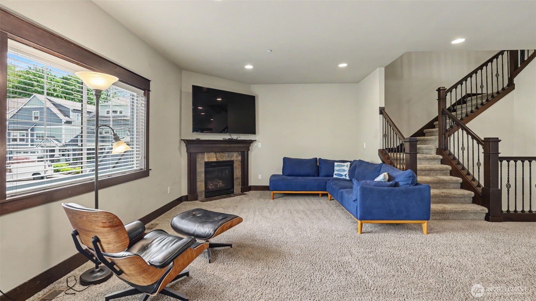 1357 Elma Place Northeast Renton, WA 98059 - Photo 6 of 40 a living room with furniture fireplace and flat screen tv