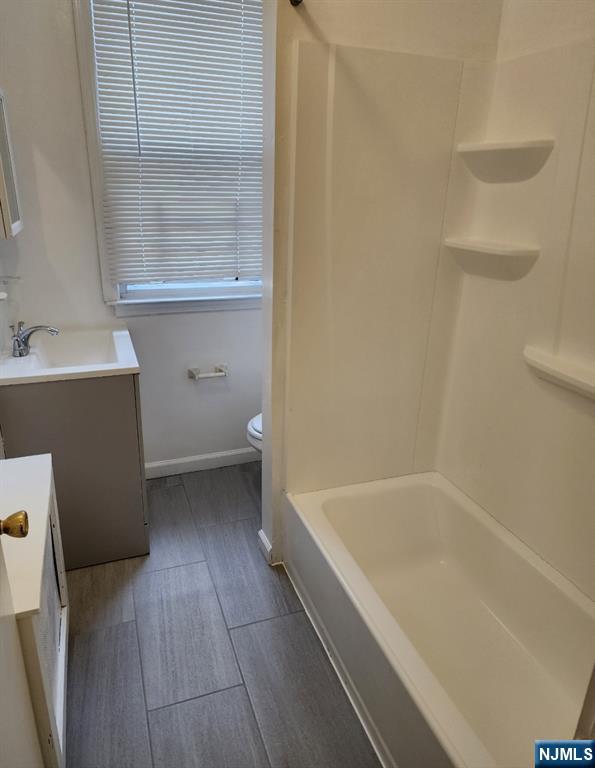 196 West End Newark, NJ 07106 - Photo 18 of 39 a bathroom with a bathtub sink and toilet