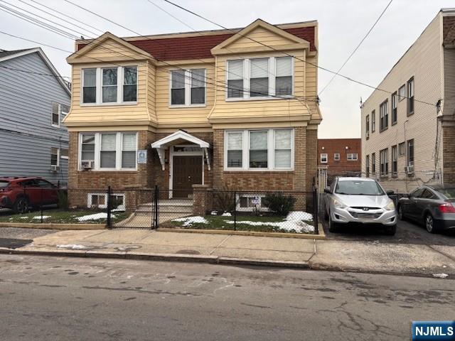 196 West End Newark, NJ 07106 - Photo 2 of 39 a couple of cars parked in front of a building