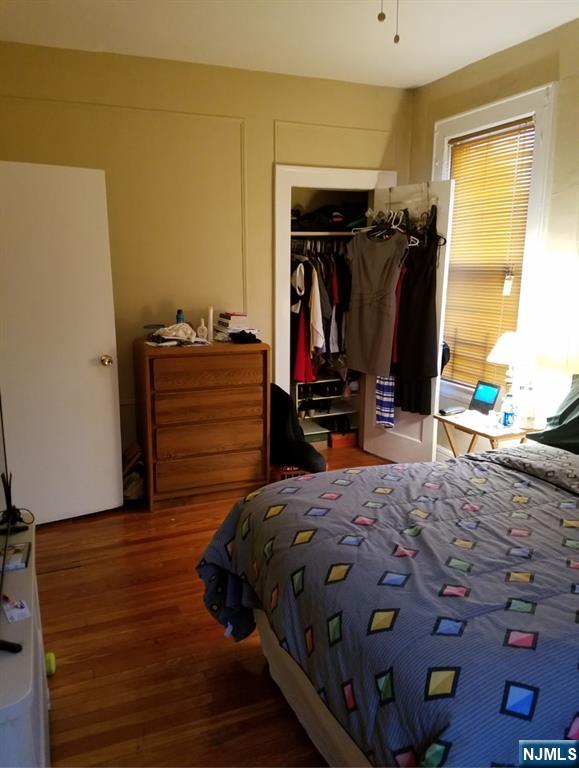 196 West End Newark, NJ 07106 - Photo 36 of 39 a bedroom with a bed and a closet