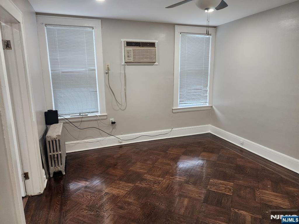 196 West End Newark, NJ 07106 - Photo 9 of 39 a view of a room with wooden floor and a ceiling fan