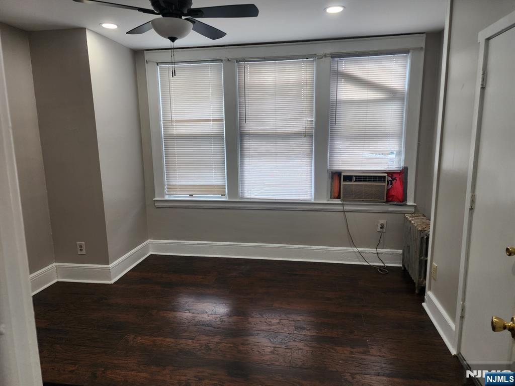 196 West End Newark, NJ 07106 - Photo 10 of 39 an empty room with wooden floor and windows