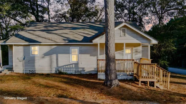 a front view of a house with garden