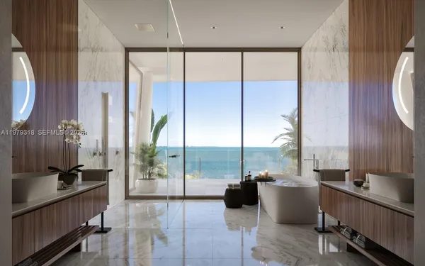 a very nice looking room with a large window and furniture