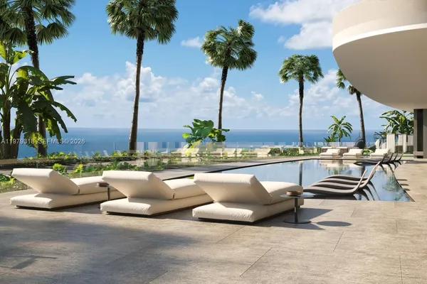 a swimming pool with outdoor seating