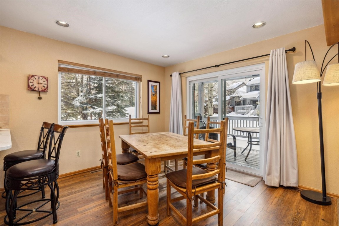 723 Hunters Circle Frisco, CO 80443 - Photo 11 of 32 a view of a dining room with furniture and wooden floor
