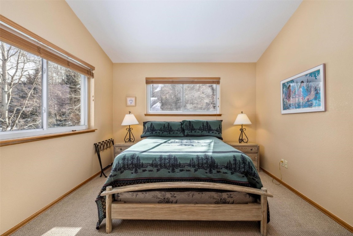 723 Hunters Circle Frisco, CO 80443 - Photo 13 of 32 a bedroom with a bed and a window
