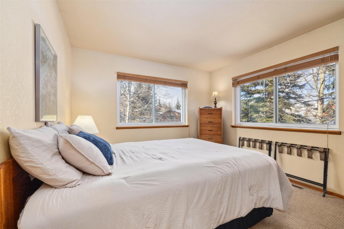 723 Hunters Circle Frisco, CO 80443 - Photo 17 of 32 a bedroom with a bed and a window
