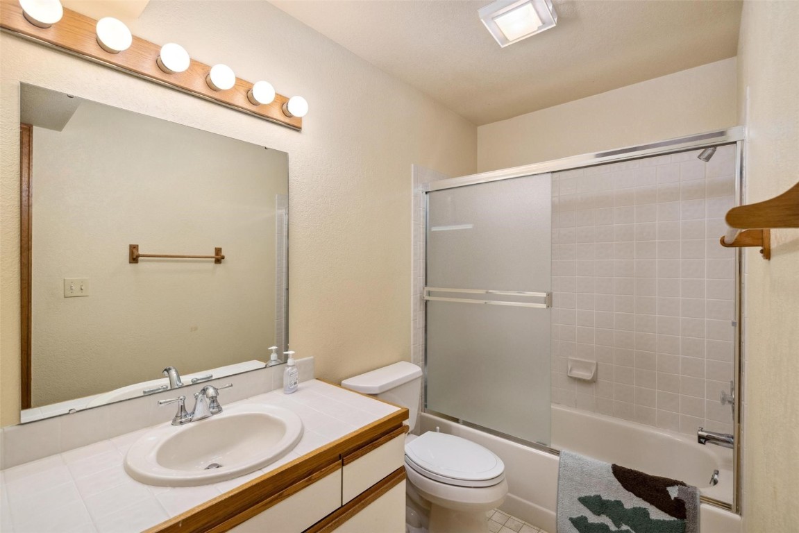 723 Hunters Circle Frisco, CO 80443 - Photo 20 of 32 a bathroom with a sink toilet and shower