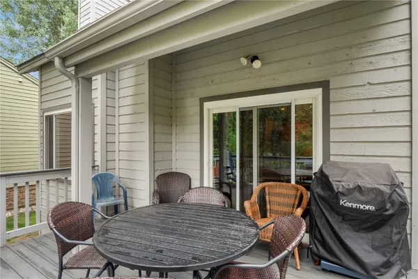 a view of balcony with furniture and wooden deck