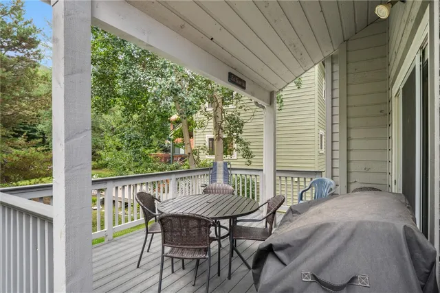 a view of a chair and table on the balcony