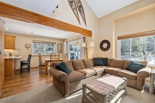 a living room with a fireplace furniture and a flat screen tv